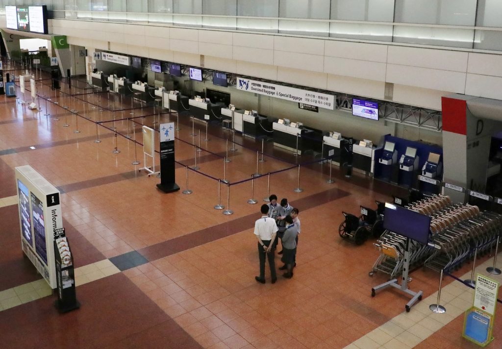 A general view of a deserted departure lobby at the Haneda International airport in Tokyo on October 12, 2019. (Jiji Press/AFP)