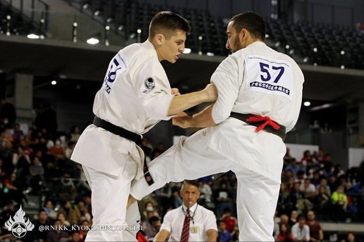 Malek (right) takes on an opponent during the Kyokushin Karate Championship in Porto, Portugal.
