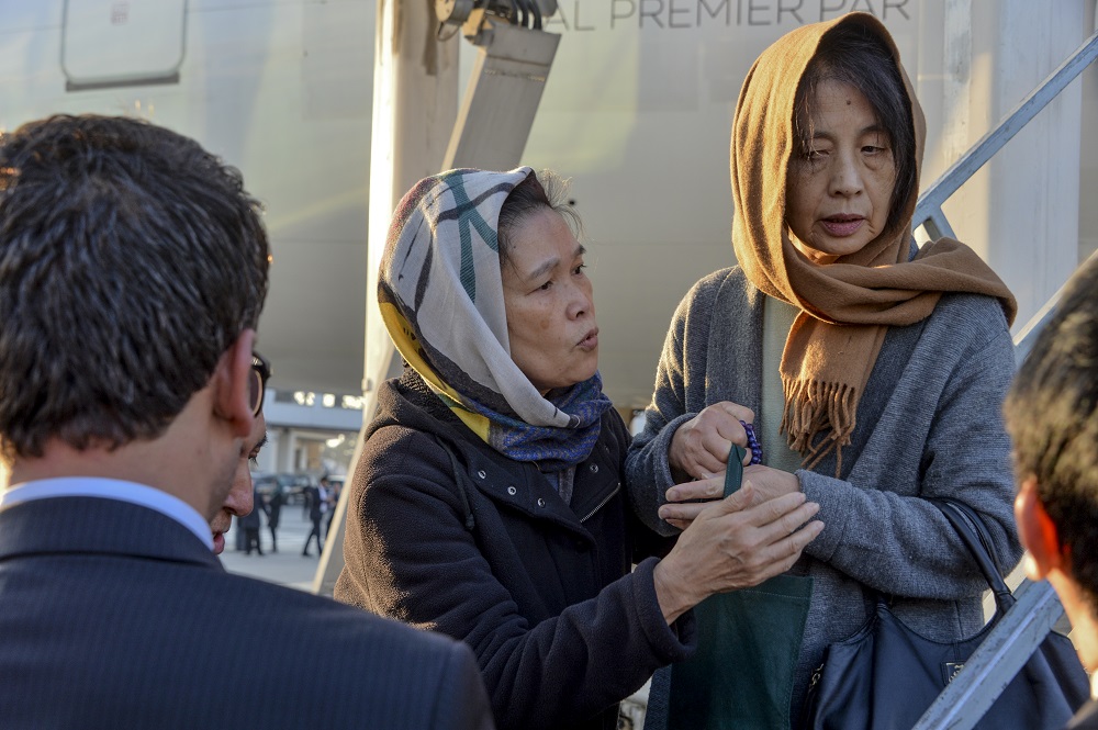 Tetsu Nakamura's wife Naoko (right) attends the ceremony for her husband. (AFP)