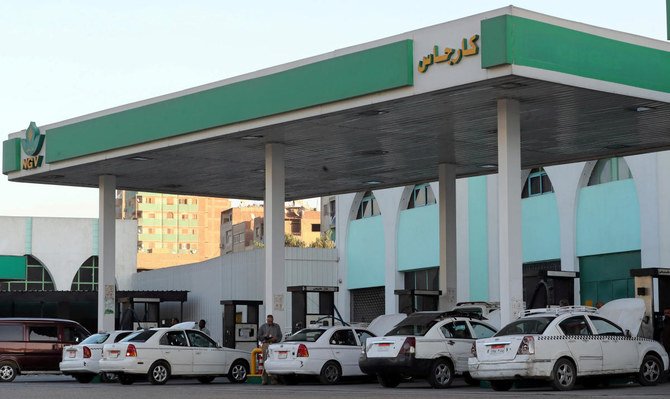 Taxis and cars are filled up with gas at Natural Gas Vehicles petrol station in Cairo, Egypt on November 27, 2019. (Reuters)