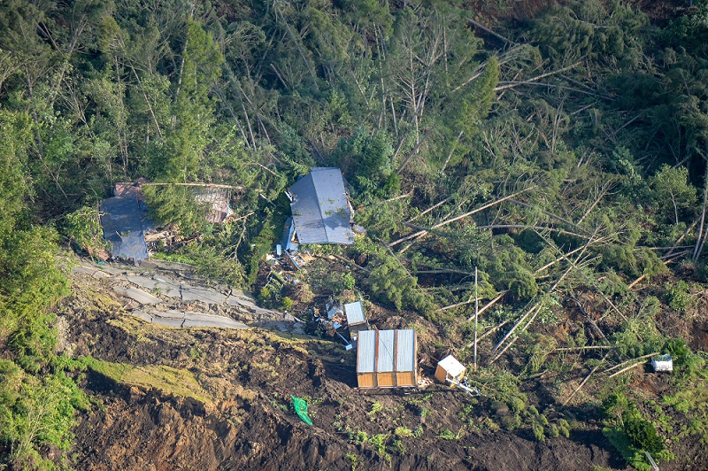 This picture shows an aerial view of houses damaged by a landslide in Atsuma town, Hokkaido prefecture on September 6, 2018, after an earthquake hit the northern Japanese island of Hokkaido. An earthquake with an estimated magnitude of 4.4 jolted the same region but there had been no report of damage when going to press. (AFP file)