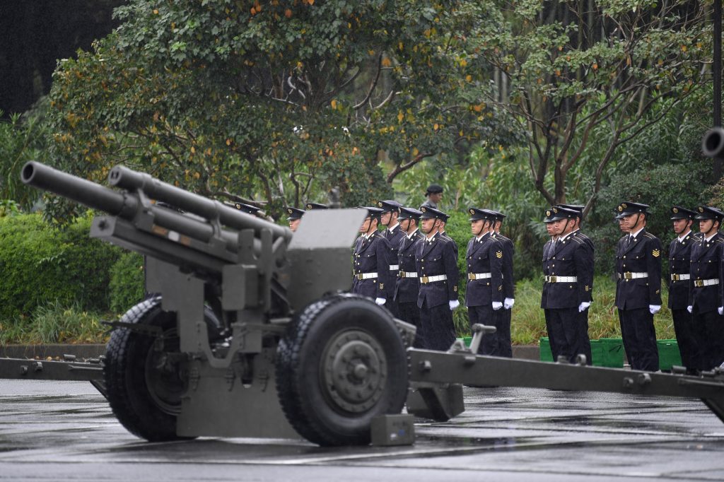 Japan Self-Defense Forces prepare to fire artilleries during the proclamation ceremony of Japan’s Emperor Naruhito's ascension to the throne at a park in Tokyo on October 22, 2019. (AFP)