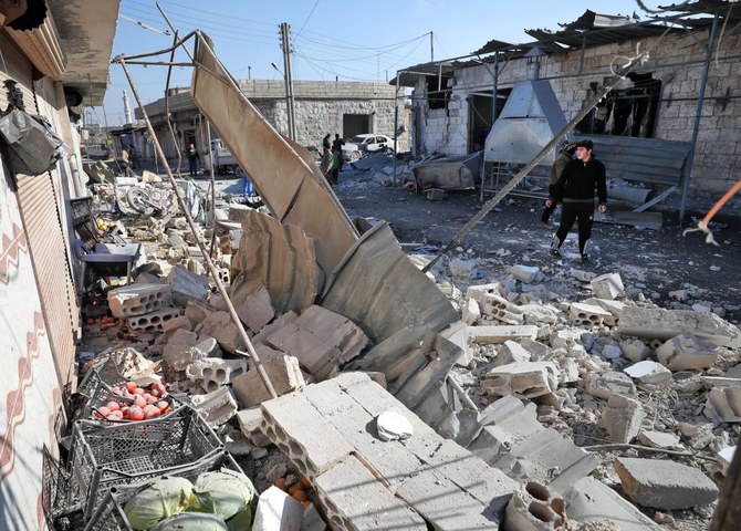 Syrians check the site of a reported government bombardment in the village of Maasaran on the outskirts of Maaret Al-Numan in Syria’s northwestern Idlib province on December 17, 2019. (File/AFP)