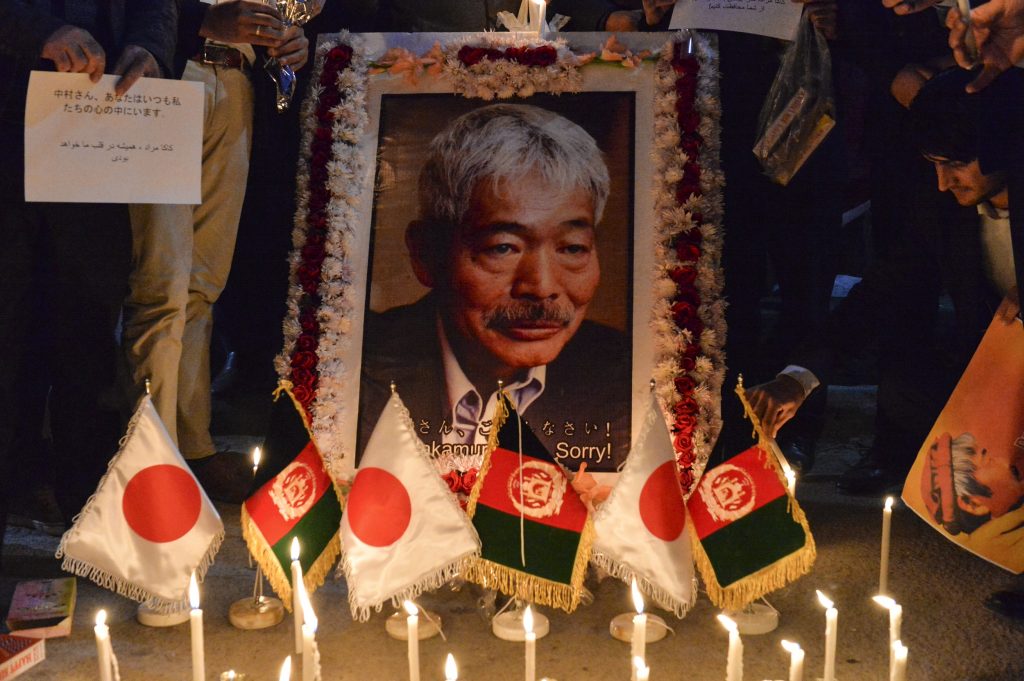 Afghan people hold a candlelight vigil for slain Japanese doctor Tetsu Nakamura, who was killed on December 4 in Jalalabad during a gunmen attack, in Kabul on December 5, 2019. (AFP)