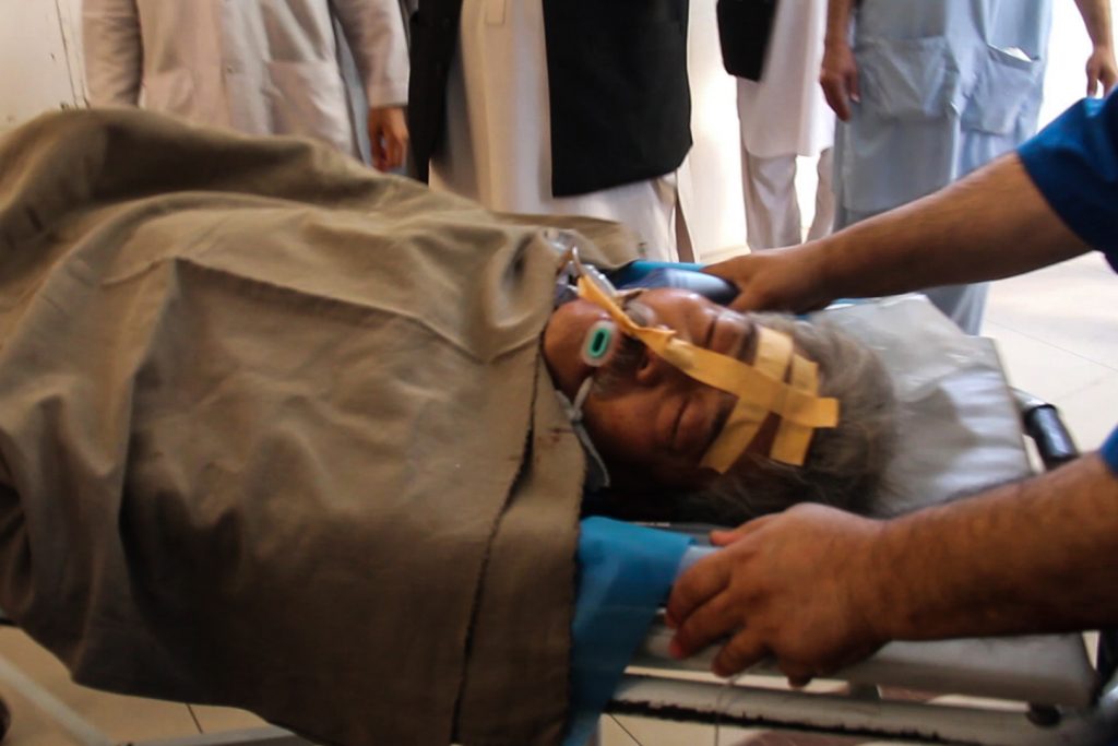 Hospital staff transfer Japanese doctor Tetsu Nakamura on a stretcher for treatment after being injured in an attack in Jalalabad on December 4, 2019. (AFP)