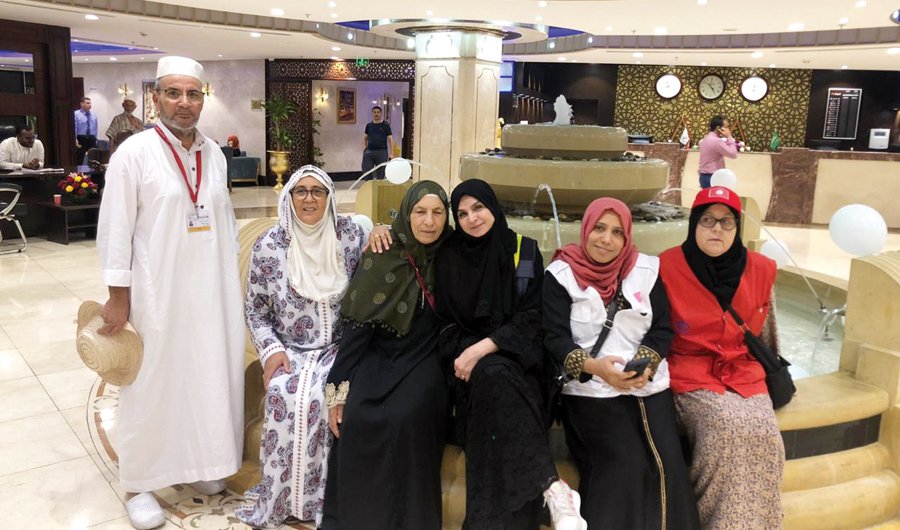 A tourist guide with visitors. The guides say they work hard on lodging and transportation requirements of visitors to ease their trip. (Photo/Supplied)