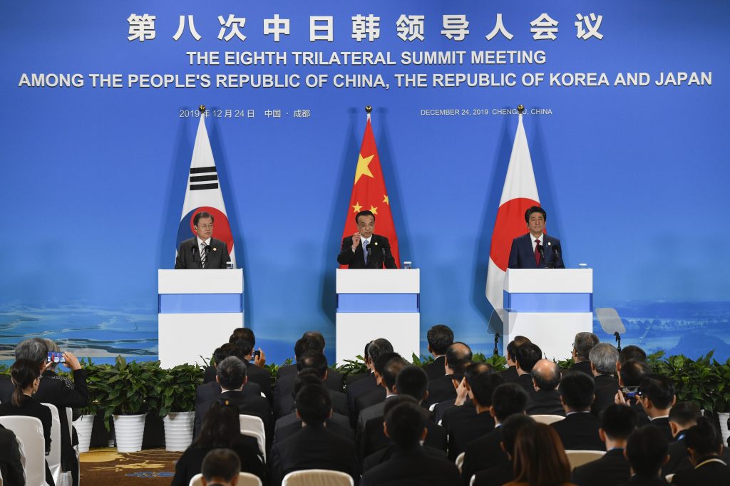 China’s Premier Li Keqiang (C) speaks as South Korea’s President Moon Jae-in (L) and Japan’s Prime Minister Shinzo Abe (R) look on during a joint press conference at the 8th trilateral leaders’ meeting in Chengdu on December 24, 2019. (AFP) 