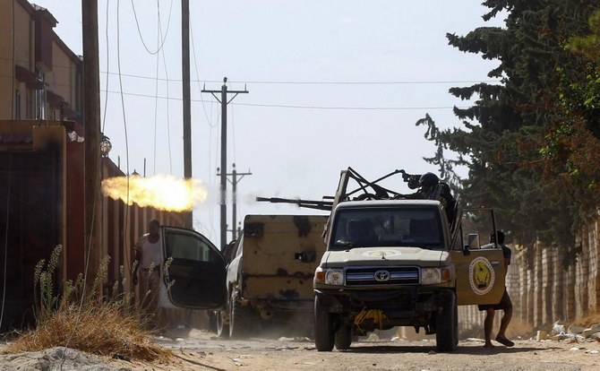 A fighter loyal to the Libyan Government of National Accord (GNA) fires a truck-mounted gun during clashes with forces loyal to strongman Khalifa Haftar in Tripoli's suburb of Ain Zara. (File/AFP)