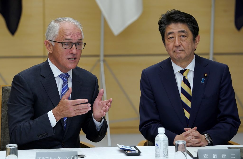 Australia’s Prime Minister Malcolm Turnbull (L front) speaks with his Japanese counterpart Shinzo Abe (R) during a meeting of Japan’s National Security Council in Tokyo on January 18, 2018. (AFP)