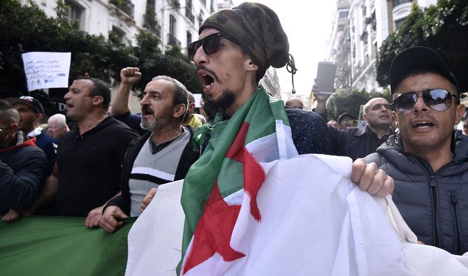 Algerians take part in a rally in Algiers on Friday. (AFP)