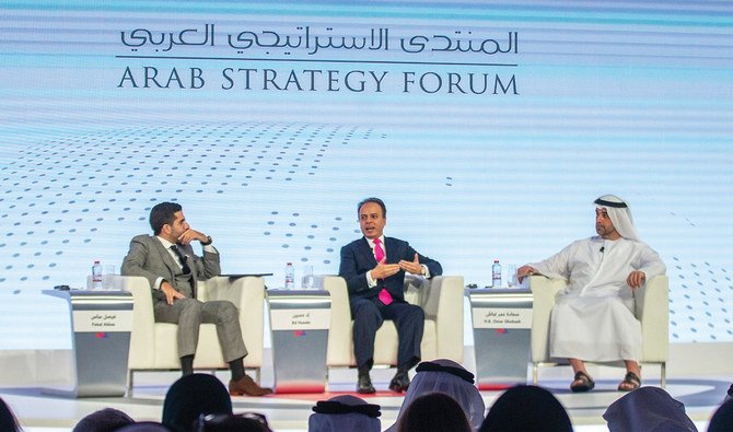 Arab Strategy Forum session in Dubai on Monday chaired by Faisal J. Abbas and featuring Ed Husain and Omar Saif Ghobash, right. (AFP)