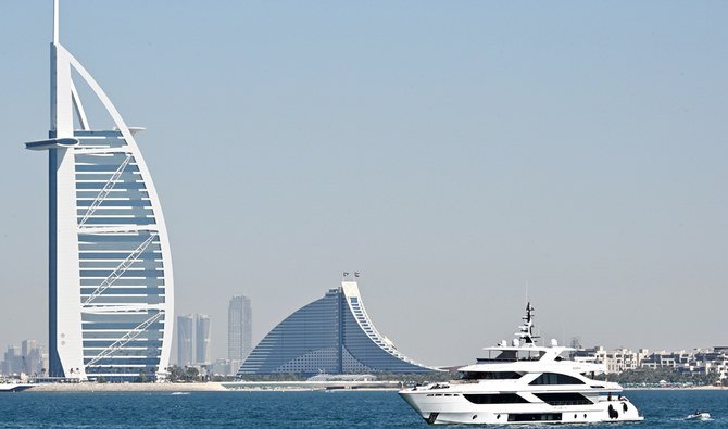 A picture taken on December 25, 2019 shows the skyline of Dubai with Burj Al Arab. (AFP)