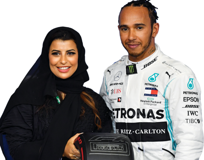 Saudi racing driver Aseel Al-Hamad presents a trophy to Lewis Hamilton. (AFP)