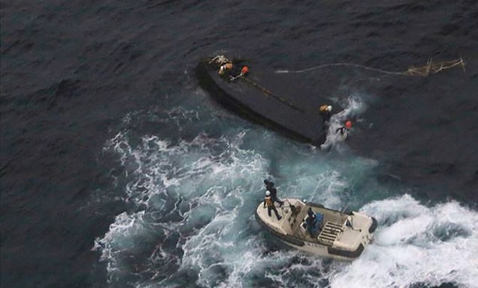 Japan’s Coast Guard regularly encounter North Korean naval vessels in distress usually involving fishing boats, such as this one in 2017, or wooden boats bearing defectors. (AFP)