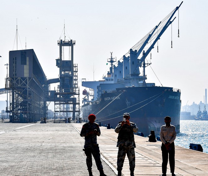 Security forces stand at the docks of Ras Al-Khair port, about 185 km north of Dammam. (AFP)