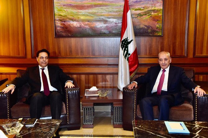Newly-assigned Lebanese Prime Minister Hassan Diab, right, met with Parliament Speaker Nabih Berri as he began consultations on forming a government of experts to deal with the country's crippling economic crisis. (Dalati Nohra via AP)