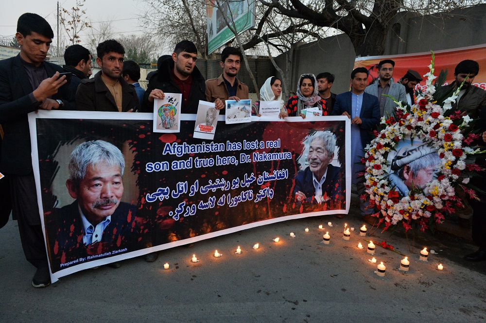 Afghan people hold a candlelight vigil for slain Japanese doctor Tetsu Nakamura, who was killed on December 4 in Jalalabad during a gunmen attack, in Kabul on December 5, 2019.