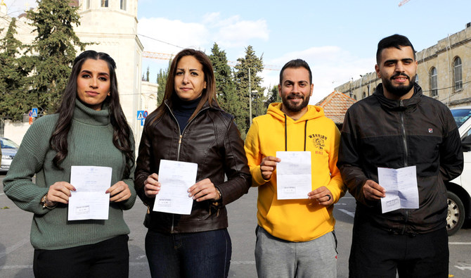 Journalists from Palestine TV, the Palestinian Authority's official TV station, pose for a photo soon after being released from detainment by Israeli police in Jerusalem December 6, 2019. (Reuters)