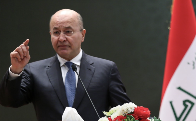 Iraqi President Barham Saleh he was ready to submit his resignation to parliament because the constitution does not give him the right to reject nominees for the premiership. (File/AFP)