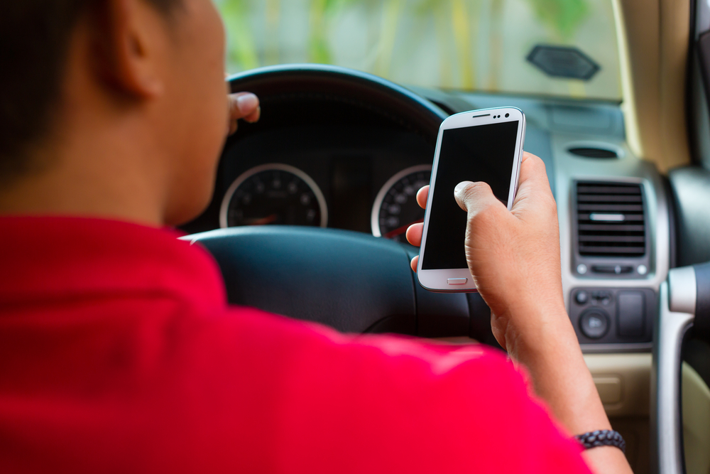 The revised Road Traffic Law in Japan has strengthened penalties for driving while using smartphones. (Shutterstock)