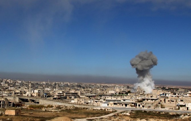 A smoke plume billows following a reported Syrian government air strike on a residential district of Maaret al-Numan in the northwestern Idlib province on December 18, 2019. (AFP)
