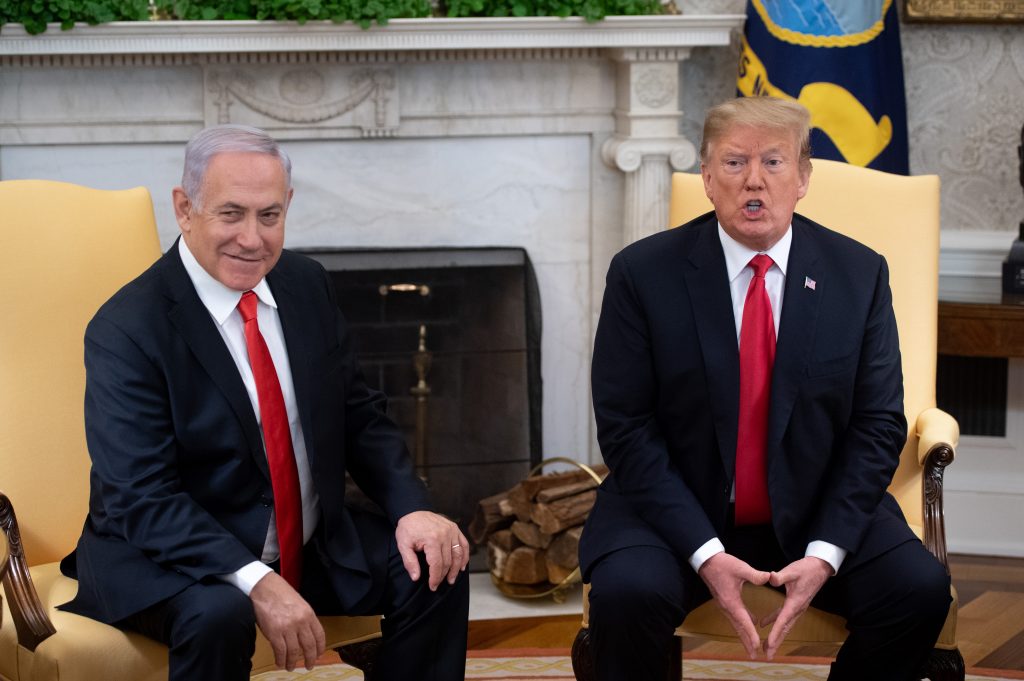 US President Donald Trump and Israeli Prime Minister Benjamin Netanyahu hold a meeting in the Oval Office at the White House in Washington, DC, March 25, 2019. (AFP)