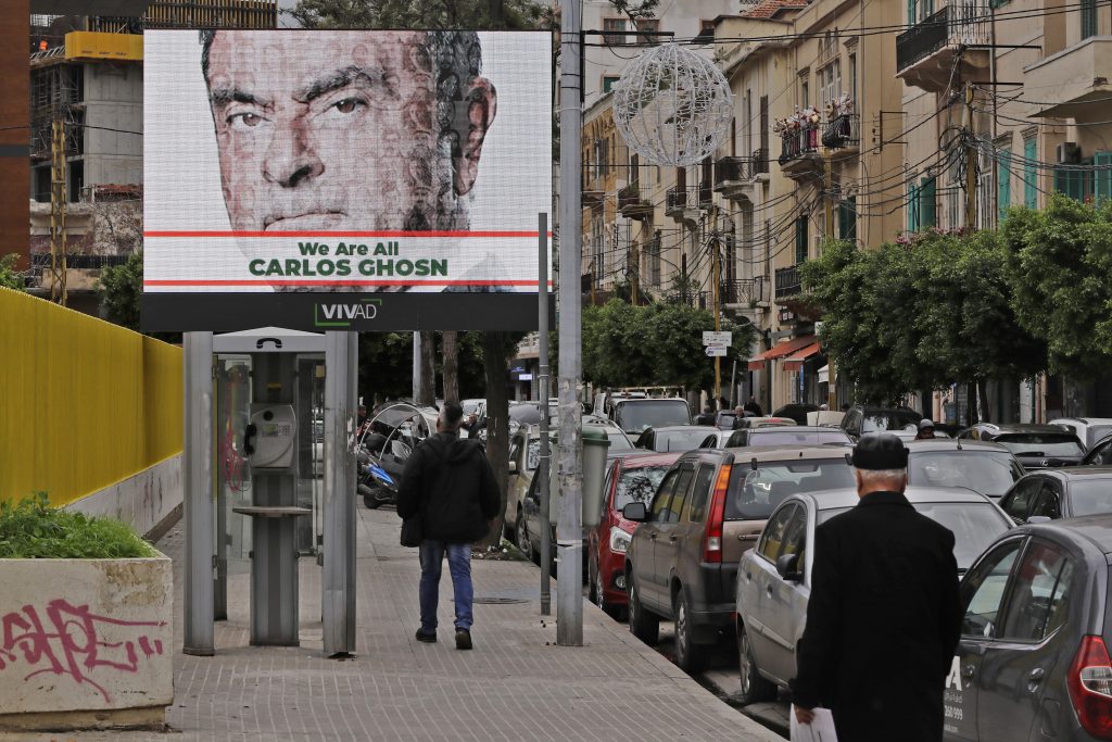  This file photo taken on December 6, 2018 shows a portrait of ousted Nissan chairman Carlos Ghosn on a publicity billboard in his support on a street in Beirut. (AFP)