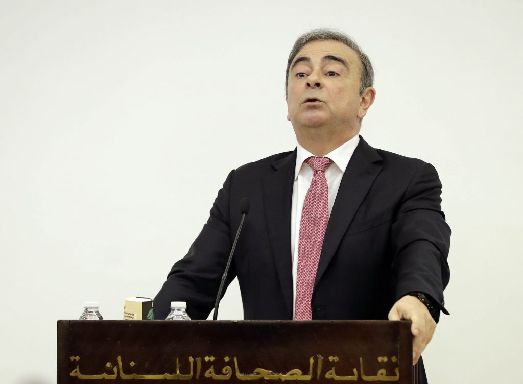 Former Renault-Nissan boss Carlos Ghosn gestures as he addresses a large crowd of journalists on his reasons for dodging trial in Japan,, at the Lebanese Press Syndicate, Beirut, on Jan. 8, 2020. (AFP)