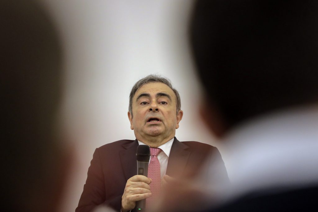 Former Renault-Nissan boss Carlos Ghosn addresses a large crowd of journalists on his reasons for dodging trial in Japan, where he is accused of financial misconduct, at the Lebanese Press Syndicate in Beirut on January 8, 2020. (AFP)