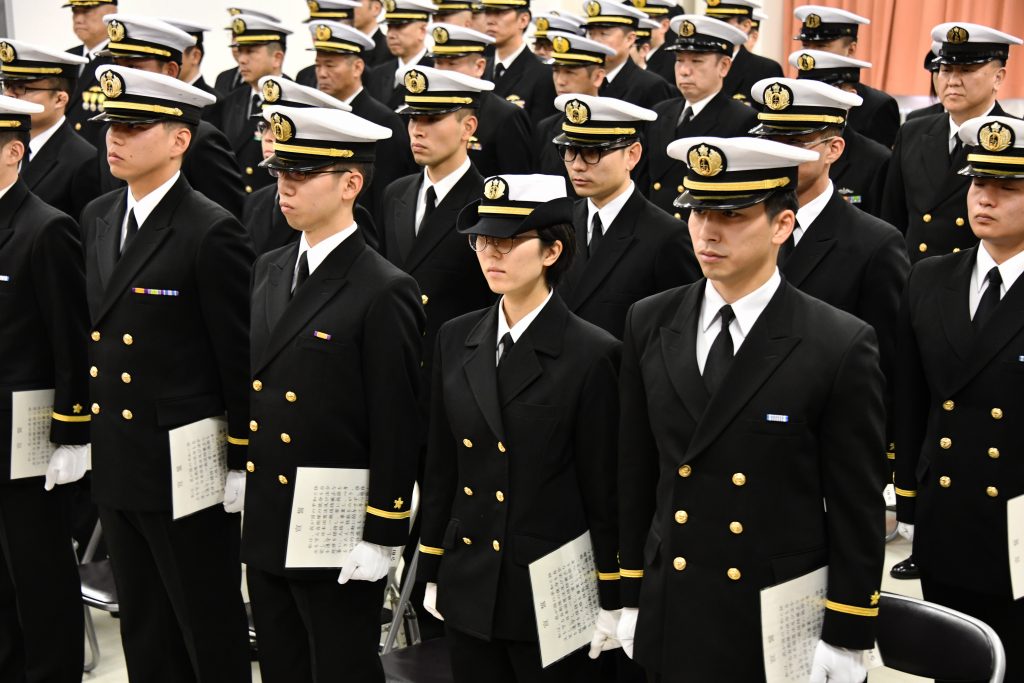 The first female student admitted to Japan's national naval submarine academy, Saki Takenouchi (front row, 2nd R). (AFP)
