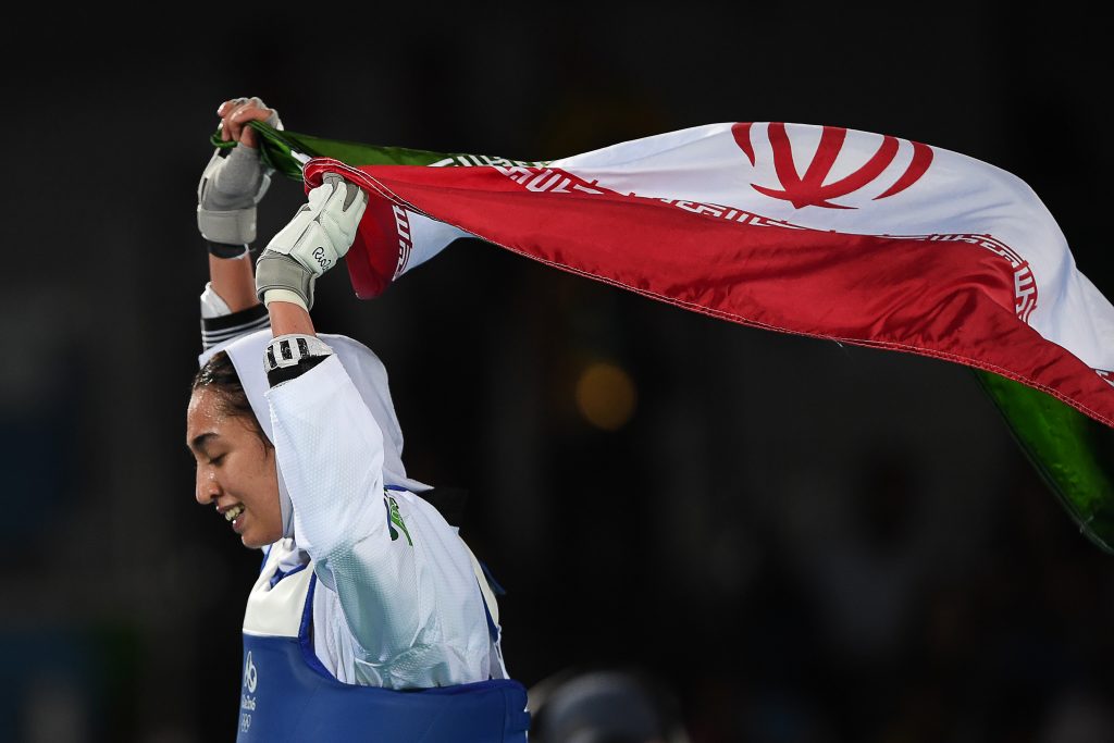 Iran's Kimia Alizadeh Zenoorin celebrates after winning against Sweden's Nikita Glasnovic as part of the 2016 Olympic Games,Aug. 18, 2016. (AFP)