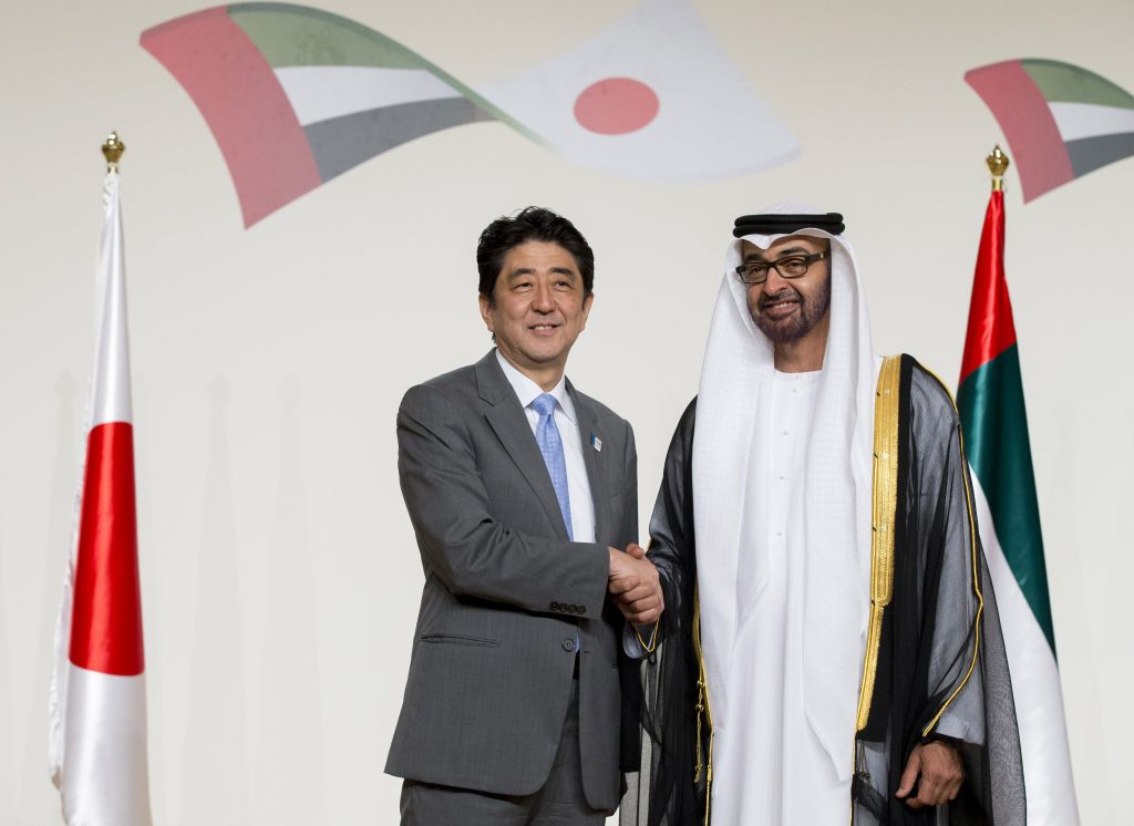 A handout picture shows Abu Dhabi Crown Prince Sheikh Mohammed bin Zayed Al Nahyan (right) posing with Japan's Prime Minister Shinzo Abe before a state dinner. (AFP)