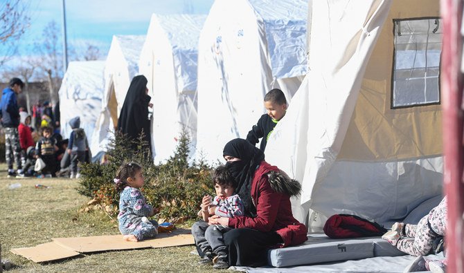 Tents setup by the government for survivors as rescue workers try to save people trapped under debris following a strong earthquake that destroyed several buildings on Friday, in Elazig, eastern Turkey, Sunday, Jan. 26, 2020. (AP)