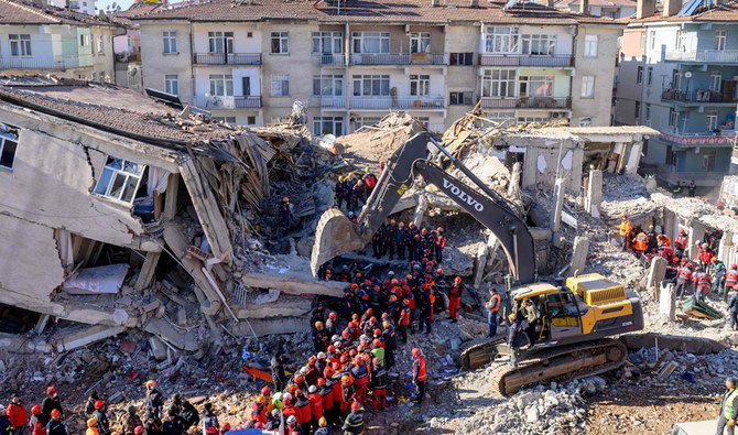 Rescue workers remove corpses from the rubble of a building after an earthquake in Elazig, eastern Turkey, on January 26, 2020. (AFP)