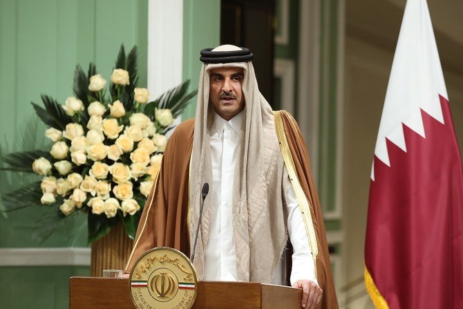 A handout picture provided by the official website of the Iranian Presidency on January 12, 2020 shows Emir of Qatar Tamim bin Hamad Al-Thani speaking during a joint press conference with the Iranian president in Tehran. (File/AFP)