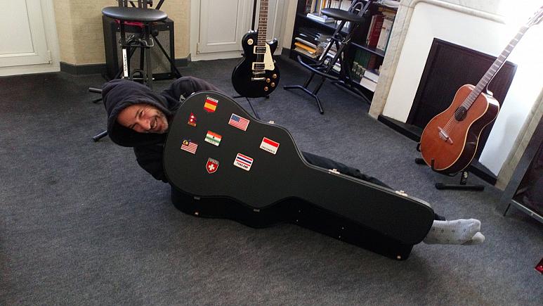 A man inside a guitar case as part of the Carlos Ghosn Challenge. (Regis Lascol/Facebook)
