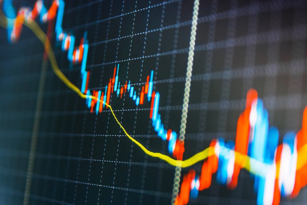 Trading stock market graph displayed on screen. (Shutterstock)