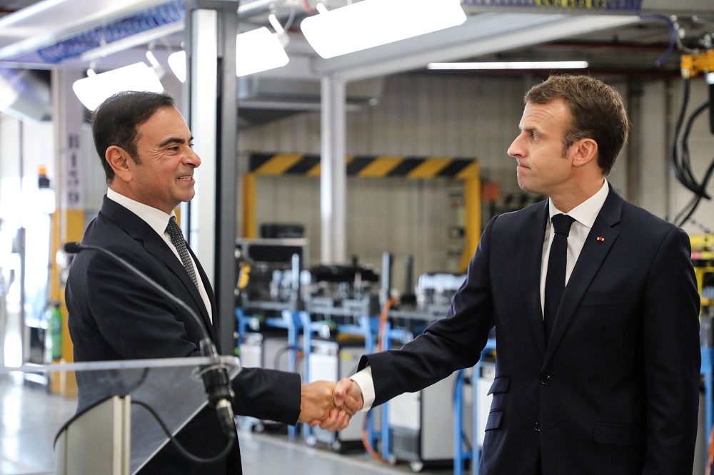 Carlos Ghosn and French president Emmanuel Macron during a meeting in 2018. (AFP/file)