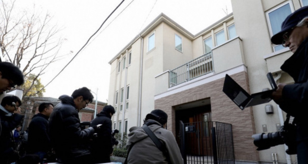 Journalists outside the home of Carlos Ghosn which was raided Thursday by Japanese prosecutors. (Supplied)