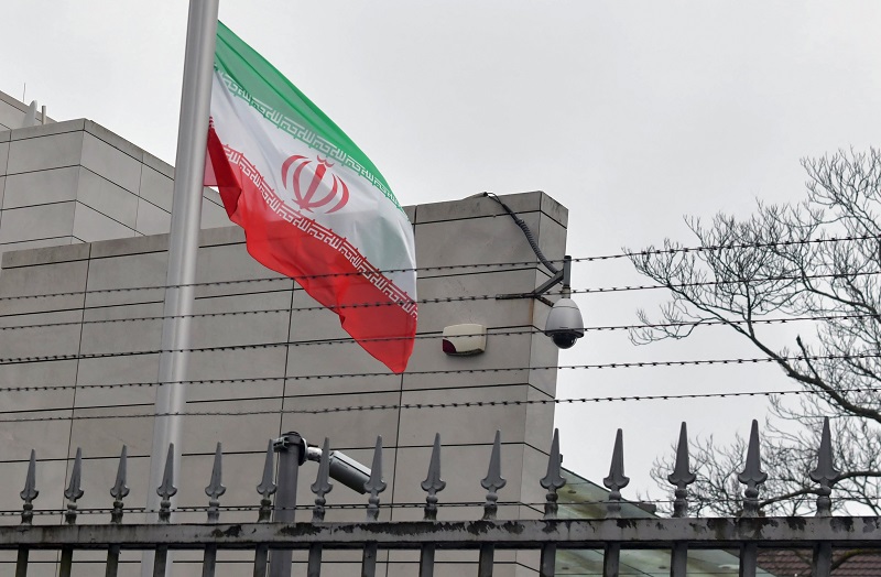 The Iranian flag flies at half-mast at their embassy in Berlin on January 3, 2020 following the killing of Iranian commander Qasem Soleimani. Germany urged restraint and de-escalation after the US killed top Iranian commander Soleimani, sending tensions soaring in the region. (AFP)