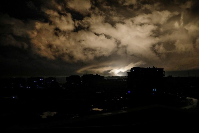 An explosion, from an air-strike, lights the sky above the rebel-held city of Idlib in northwestern Syria on Jan. 1, 2020. (Abdullah Hammam/AFP)