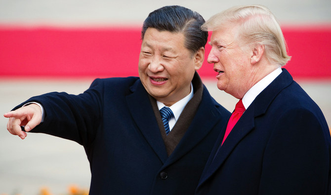 China’s President Xi Jinping and US President Donald Trump at a welcome ceremony in Beijing in 2017. A new partial trade agreement between the US and China will be signed in the middle of this month in Washington, Trump said on Tuesday. “I will be signing our very large and comprehensive Phase One Trade Deal with China on January 15,” he tweeted moments before Wall Street was due to open. (AFP)