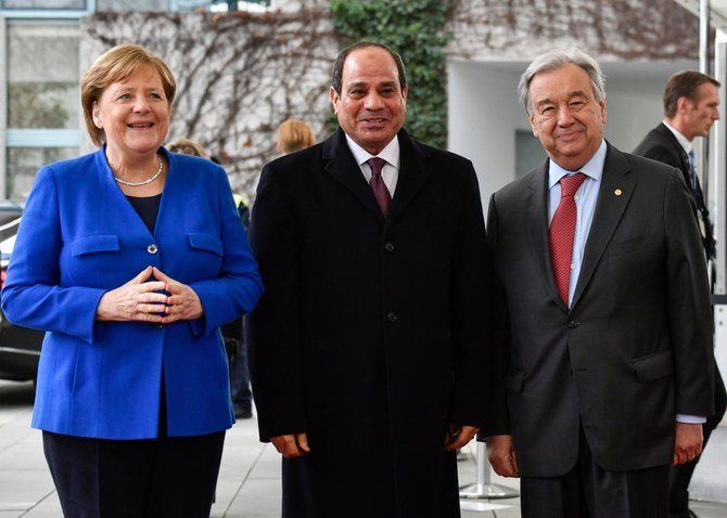 German Chancellor Angela Merkel and UN Antonio Guterres greet Egyptian President Abdul Fattah El-Sisi as he arrives to attend a Libya peace summit in Berlin on Sunday. (AFP)