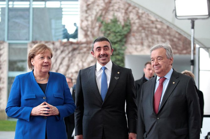 UAE Minister of Foreign Affairs Abdullah bin Zayed Al-Nahyan poses for a picture with German Chancellor Angela Merkel and United Nations Secretary-GeneralÂ Antonio Guterres. (Reuters)