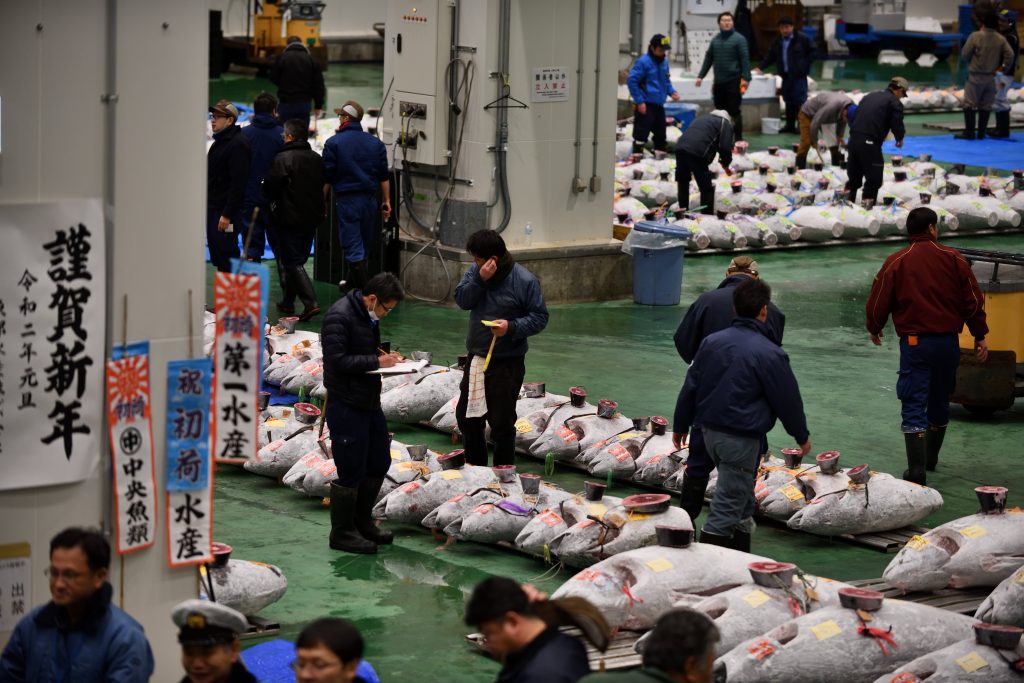 Wholesalers participate in the New Year's auction at Tokyo's Toyosu fish market on Jan. 5, 2020. (AFP)