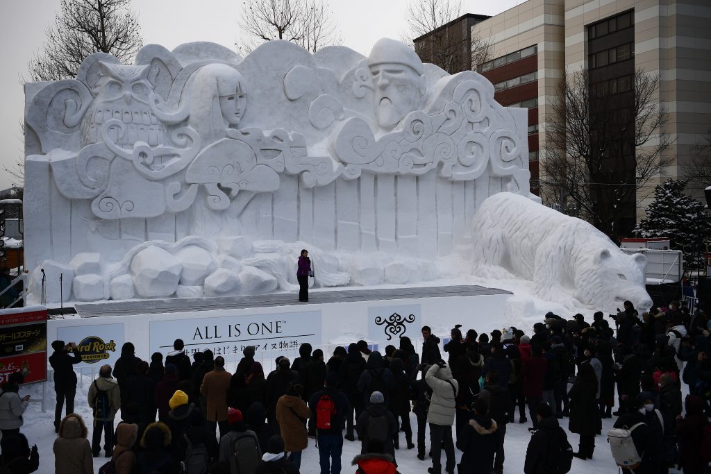A giant snow sculpture supported by Sapporo Television Broadcasting representing the indigenous northern Japanese peoples Ainu creation myth Ainu Rakkur, is seen during the Sapporo Snow Festival in Sapporo on February 4, 2020. (AFP)