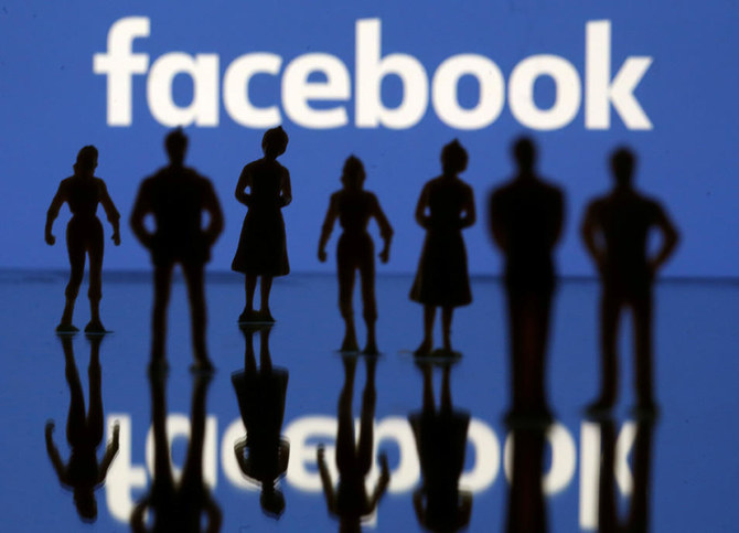 Small toy figures are seen in front of Facebook logo in this illustration picture. (REUTERS/Dado Ruvic/Illustration/File Photo)