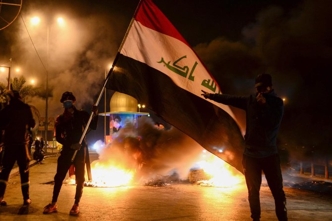 Main highways leading out of Najaf and streets within the city were still blocked off with smoldering tires on Sunday morning. (AFP)