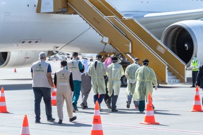 Saudi health authorities receiving students evacuated from China's coronavirus city at Riyadh's King Khalid International Airport on Feb. 2, 2020. (SPA)