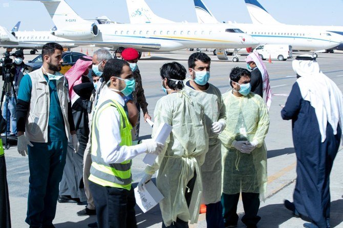 Saudi health authorities receiving students evacuated from China's coronavirus city at Riyadh's King Khalid International Airport on Feb. 2, 2020. (SPA)